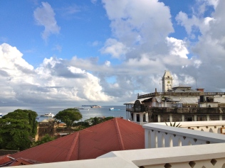 View of Stone Town harbor from hotel terrace.